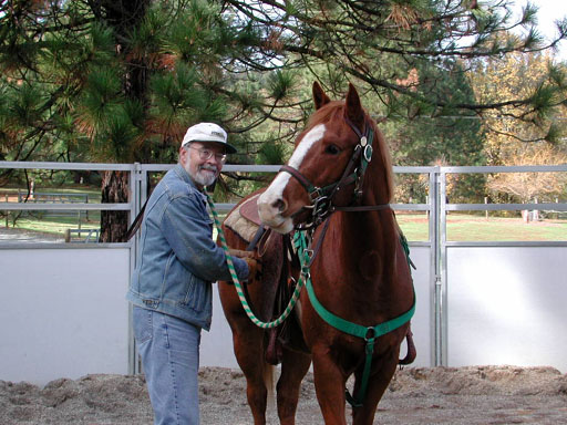 [John and Pepper in the round pen]